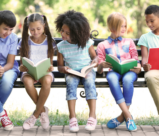 A group of students sitting together, reading