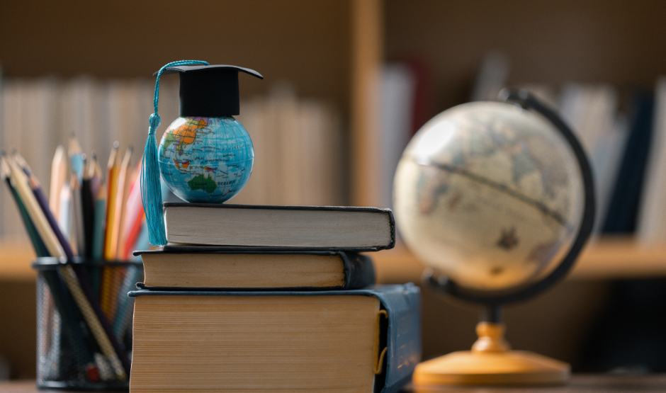 a globe on top of some books