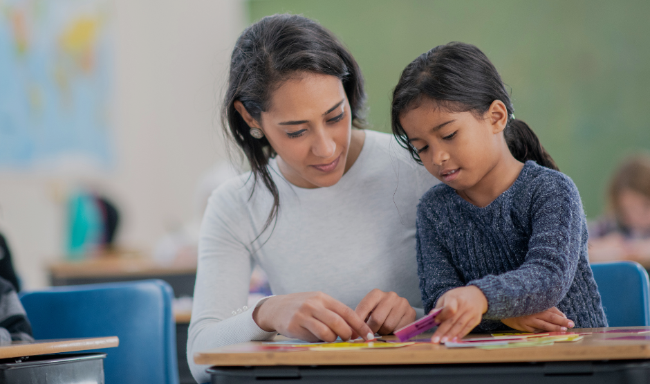 Teacher working with a student