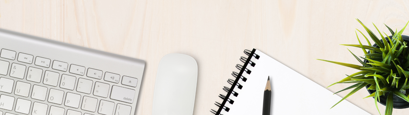 Computer keyboard, mouse and a notebook