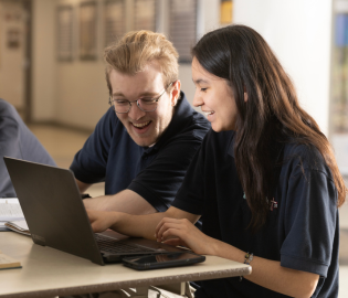 Students working together on a laptop